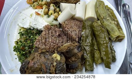Delicious Arabian food on a plate with many varieties