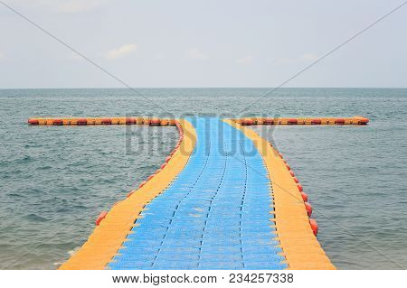 Plastic Floating Port On Sea,harbor At Convenience In The Time Of Low Water Tide.