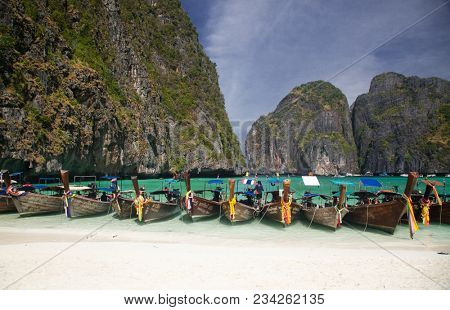 KO PHI PHI LEH, THAILAND, February 1, 2014: Overcrowded beach of Maya Bay, Andaman Sea, famous tourist destination in the Ko Phi Phi achipelago