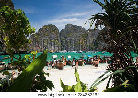 KO PHI PHI LEH, THAILAND, February 1, 2014: Overcrowded beach of Maya Bay, Andaman Sea, famous tourist destination in the Ko Phi Phi achipelago