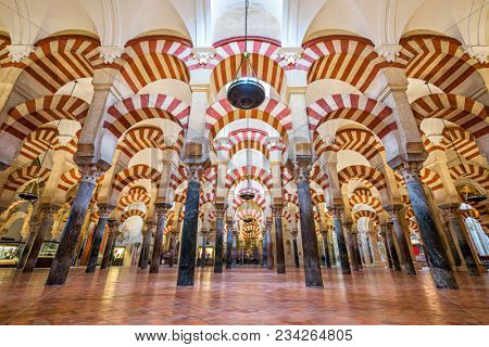 CORDOBA, SPAIN - NOVEMBER 10, 2014: Hypostyle Hall in the Mosque-Cathedral of Cordoba. The site has a rich religious history and is currently an active cathedral.