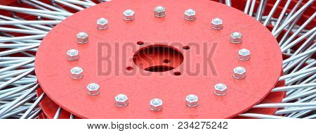 New Red Tedder For Trailer In Agricultural Machinery For Gathering Hay. Close Up