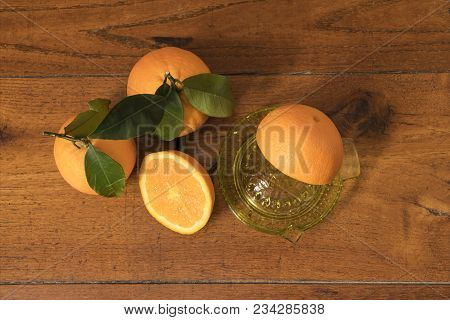 Make A Juice Of Oranges On A Wooden Table