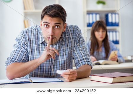Students sitting and studying in classroom college