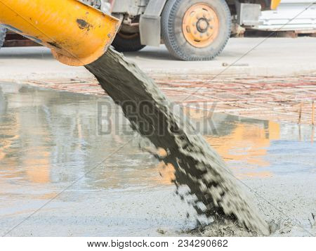 Pouring Ready-mixed Concrete After Placing Steel Reinforcement To Make The Road By Mixing Mobile The