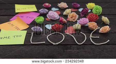 Front View Of Me Too Message Written In Colorful Stickers On A Love Knoted Background.