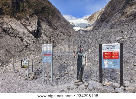 25 July 2014: West Coast, New Zealand - Franz Josef Glacier, With Sign Warning Of How Dangerous It I