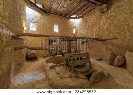 Cairo, Egypt - March 24 2018: Ancient Rotary Flour Mill Used To Be Rotated By Animal Power At The Mo