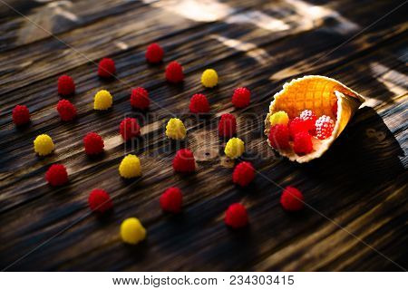 Waffle Cone With Berries On A Wooden Background.