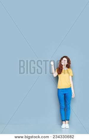 Pleasant Feelings. Joyful Positive Nice Woman Smiling And Looking Up While Being In A Good Mood