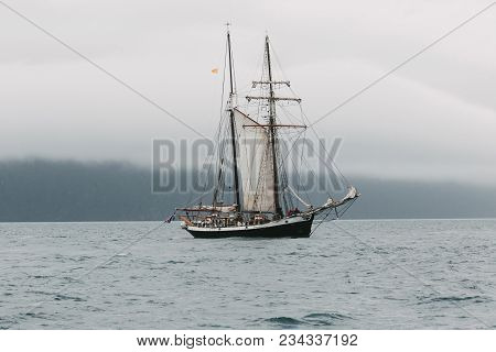 Husavik, Iceland - 20 July, 2016: Yacht Floating On Waves Near Icelandic Coast, Husavik, Iceland