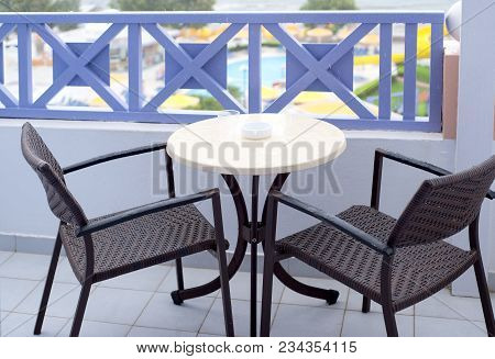Outdoor Table And Chairs During The Rain