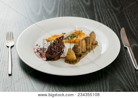 Meat Dish With Vegetables On The Plate
