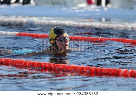 ST. PETERSBURG, RUSSIA - MARCH 4, 2018: Winter swimming competitions for Big Neva Cup. Winter swimmers from 12 countries aged from 12 to 78 take part in the competitions this year