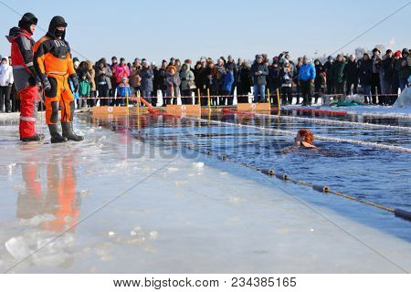 ST. PETERSBURG, RUSSIA - MARCH 4, 2018: Winter swimming competitions for Big Neva Cup. Winter swimmers from 12 countries aged from 12 to 78 take part in the competitions this year