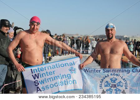 ST. PETERSBURG, RUSSIA - MARCH 4, 2018: Winter swimming competitions for Big Neva Cup. Winter swimmers from 12 countries aged from 12 to 78 take part in the competitions this year