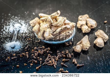 Close Up Of Ayurvedic Herb Or Folk Medicine Dried Ginger Or Zingiber Officinale With Black Pepper Co