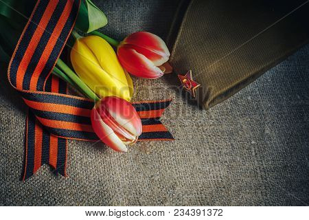 Military Cap With Order Of Great Patriotic War And Tulips Flowers Tied By Saint George Ribbon In Hon