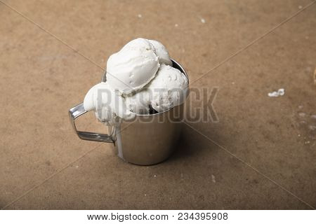 Variety Of Ice Cream Scoops In Cones With Chocolate, Vanilla And Strawberry.