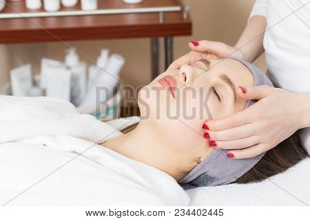 Facial Massage For A Beautiful Girl In A Spa Salon