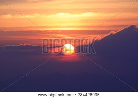 The Sun Is Falling, The Cloud Cover The Orange Light Of The Sun.