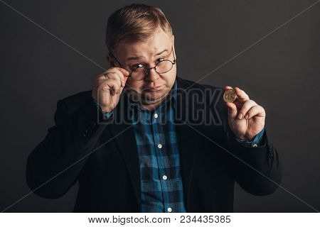 Fat Man Pointing At Golden Bitcoin In Hand, Digitall Symbol Of New Virtual Currency