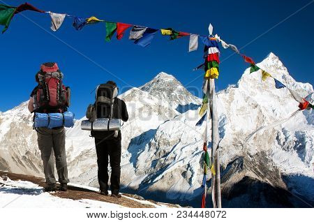 View Of Mount Everest With Tourists And Buddhist Prayer Flags From Kala Patthar And Blue Sky - Way T