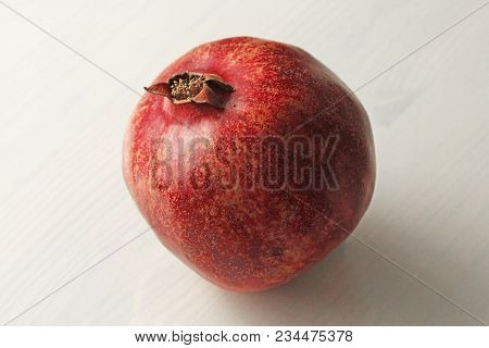 Big Ripe Red Granet Or Garnet. Fruits Of Red Ripe Pomegranate On The White Background. Vegetarian Co
