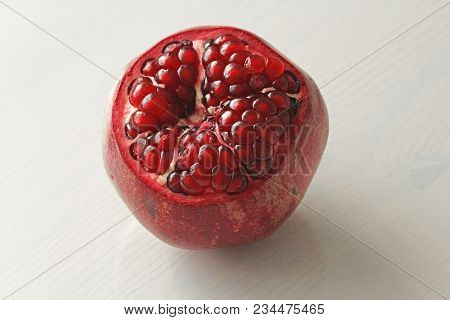 Big Ripe Red Granet Or Garnet. Fruits Of Red Ripe Pomegranate On The White Background. Vegetarian Co