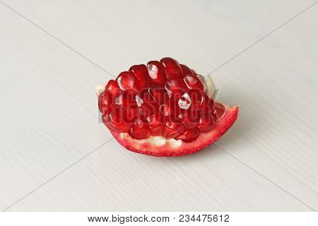 Big Ripe Red Granets Or Garnets. Fruits Of Red Ripe Pomegranate On The White Background. Vegetarian 