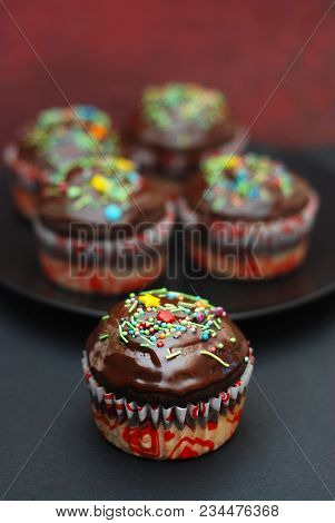 Homebaked Chocolate Muffins For Easter With Colored Conffeti.