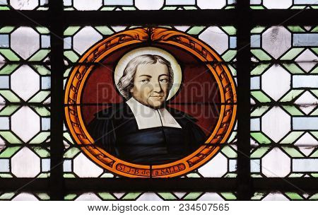 PARIS, FRANCE - JANUARY 04: Saint Jean Baptiste de la Salle, stained glass window in the Saint Sulpice Church, Paris, France on January 04, 2018.