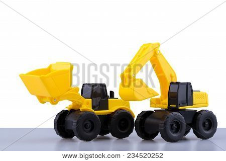 Heavy Duty Construction Backhoe And Tractor Toy Isolated On White Background.