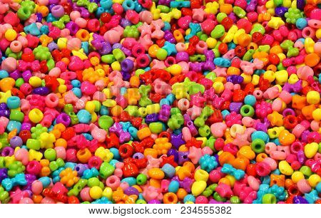 Background Of Small Fashion Accessories To Create Necklaces For Children