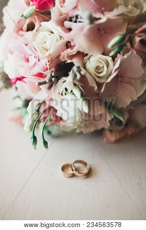 Two Golden Wedding Rings Isolated Background Concept.