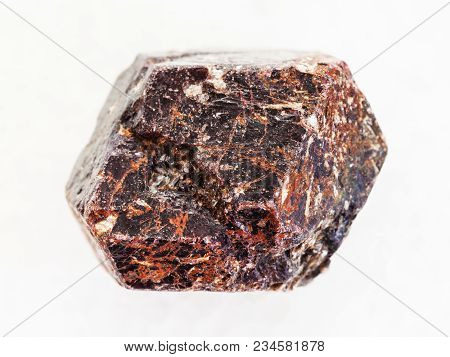 Macro Shooting Of Natural Mineral Rock Specimen - Rough Crystal Of Dravite Tourmaline Gemstone On Wh