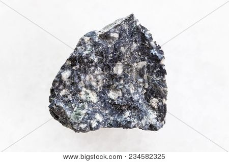 Macro Shooting Of Natural Mineral Rock Specimen - Raw Andesite Stone On White Marble Background