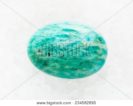 Macro Shooting Of Natural Mineral Rock Specimen - Tumbled Amazonite Gemstone (amazon Stone) On White