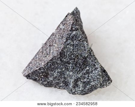 Macro Shooting Of Natural Mineral Rock Specimen - Rough Olivinite Stone On White Marble Background F