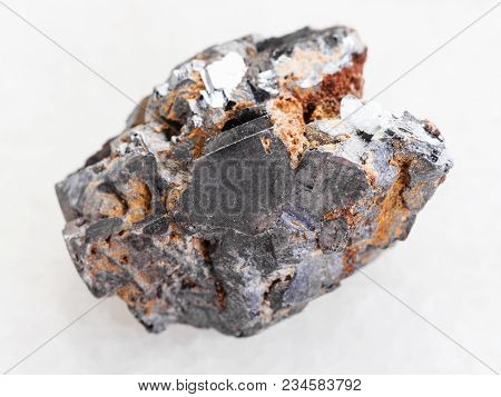 Macro Shooting Of Natural Mineral Rock Specimen - Rough Galenite Stone On White Marble Background
