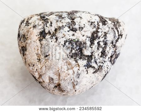 Macro Shooting Of Natural Mineral Rock Specimen - Diorite Stone On White Marble Background