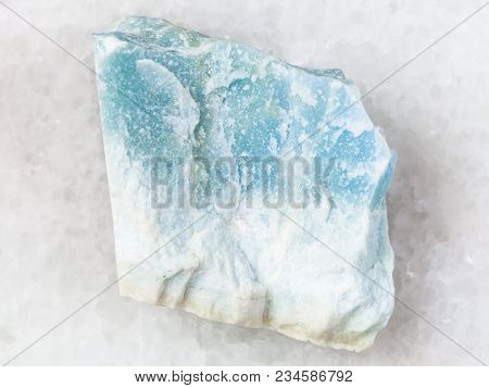 Macro Shooting Of Natural Mineral Rock Specimen - Raw Blue Violane Stone On White Marble Background 