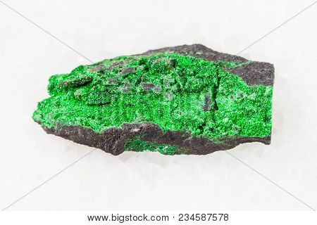 Macro Shooting Of Natural Mineral Stone Specimen - Green Uvarovite Crystals On Rough Rock On White M