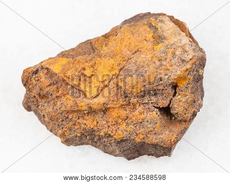 Macro Shooting Of Natural Mineral Rock Specimen - Rough Limonite Stone On White Marble Background Fr