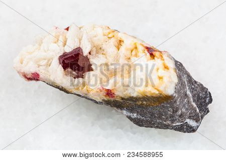 Macro Shooting Of Natural Mineral Rock Specimen - Red Crystal Of Cinnabar In Raw Carbonatite Stone O