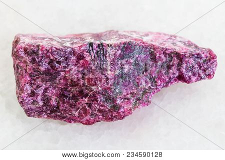 Macro Shooting Of Natural Mineral Rock Specimen - Rough Eudialyte Stone On White Marble Background F