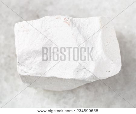 Macro Shooting Of Natural Mineral Rock Specimen - Rough Chalkstone On White Marble Background From V