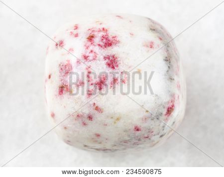 Macro Shooting Of Natural Mineral Rock Specimen - Cinnabar In Polished White Dolomite Stone On White