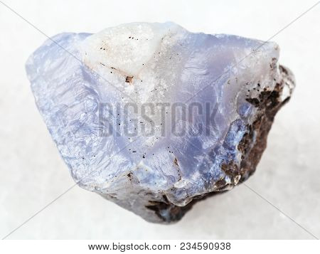 Macro Shooting Of Natural Mineral Rock Specimen - Raw Crystal Of Blue Chalcedony Gemstone On White M