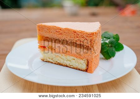 Pie With Peach Souffle. A Piece Of Peach Pie With A Souffle On A Plate.